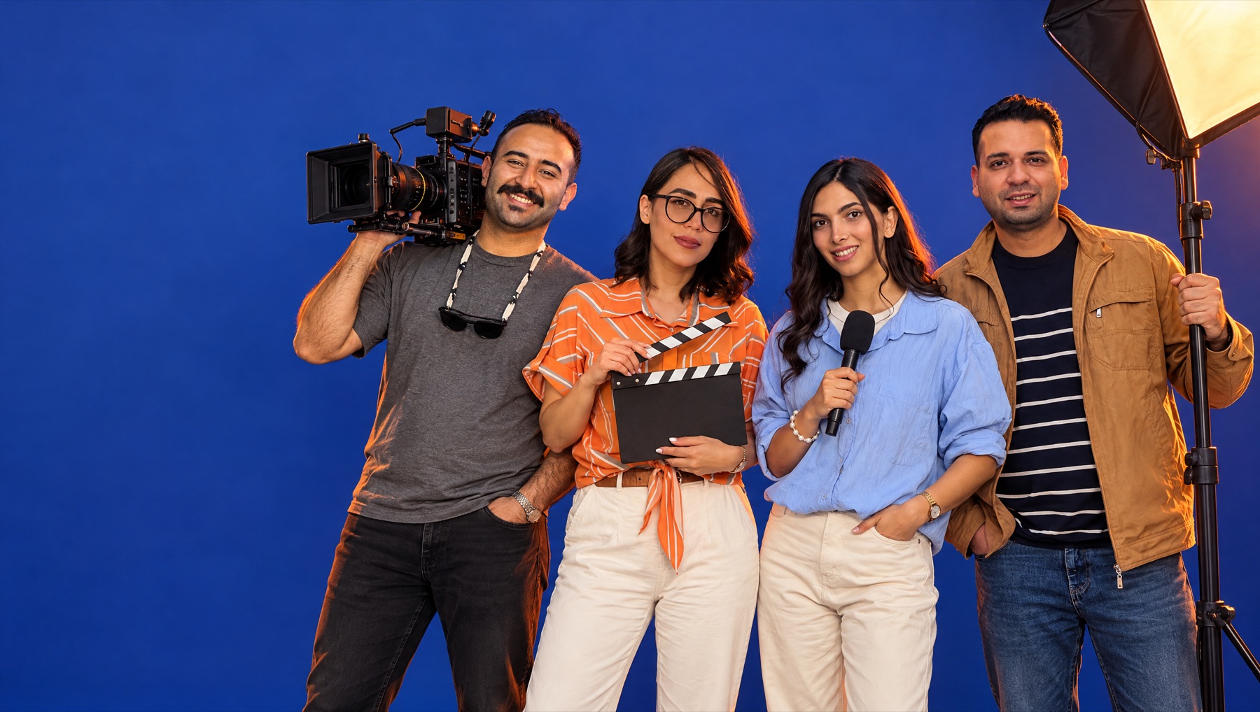 The Kleos crew in the studio: camera, clapperboard, microphone and light.